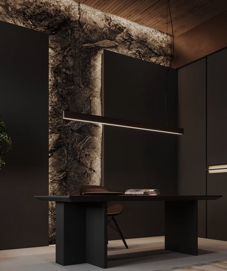 Sculptural desk against a backlit natural stone feature wall