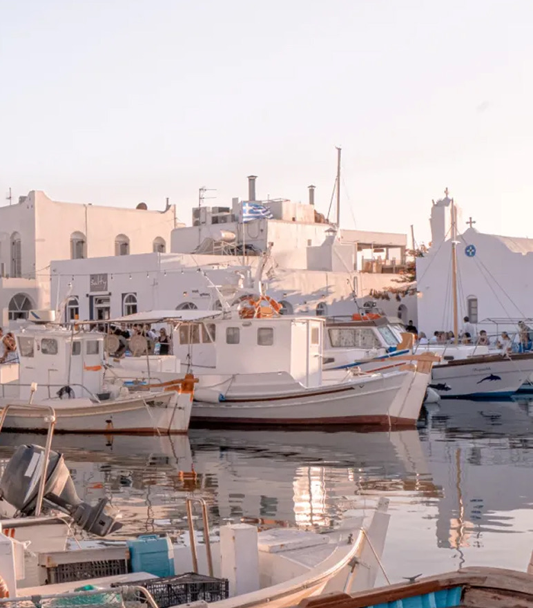Fishing boats moored in the old port of Naoussa, by the church of Agios Nikolaos