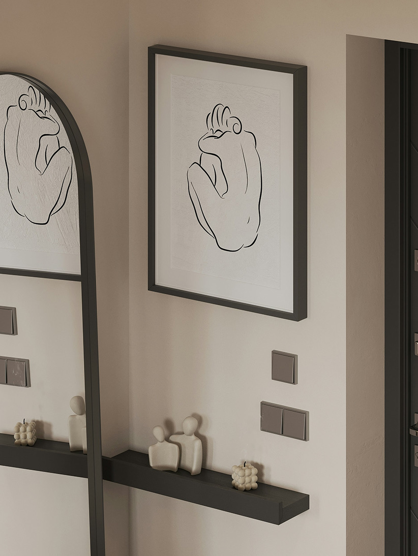 Line-drawing prints above a black shelf beside a tall arched mirror