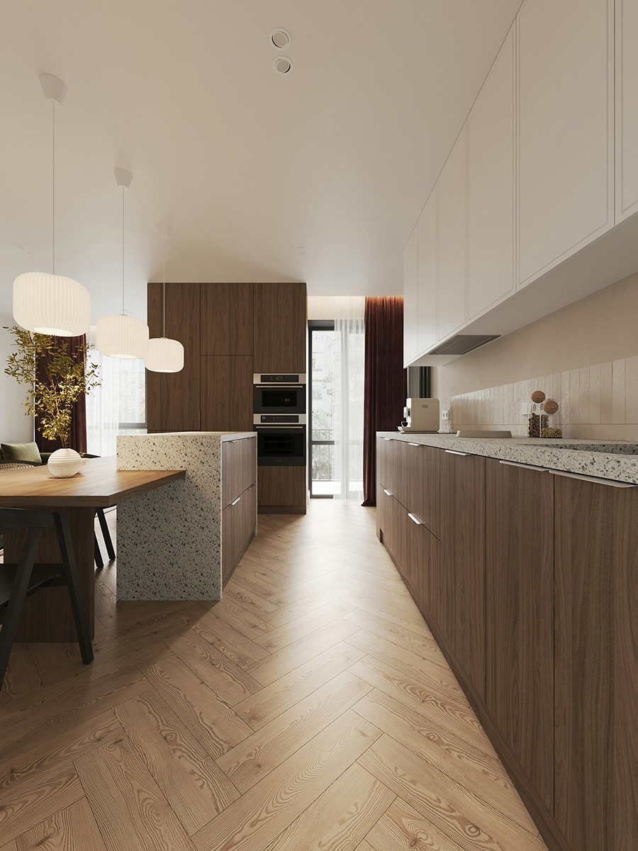 A galley kitchen in walnut with pendant lights over the island