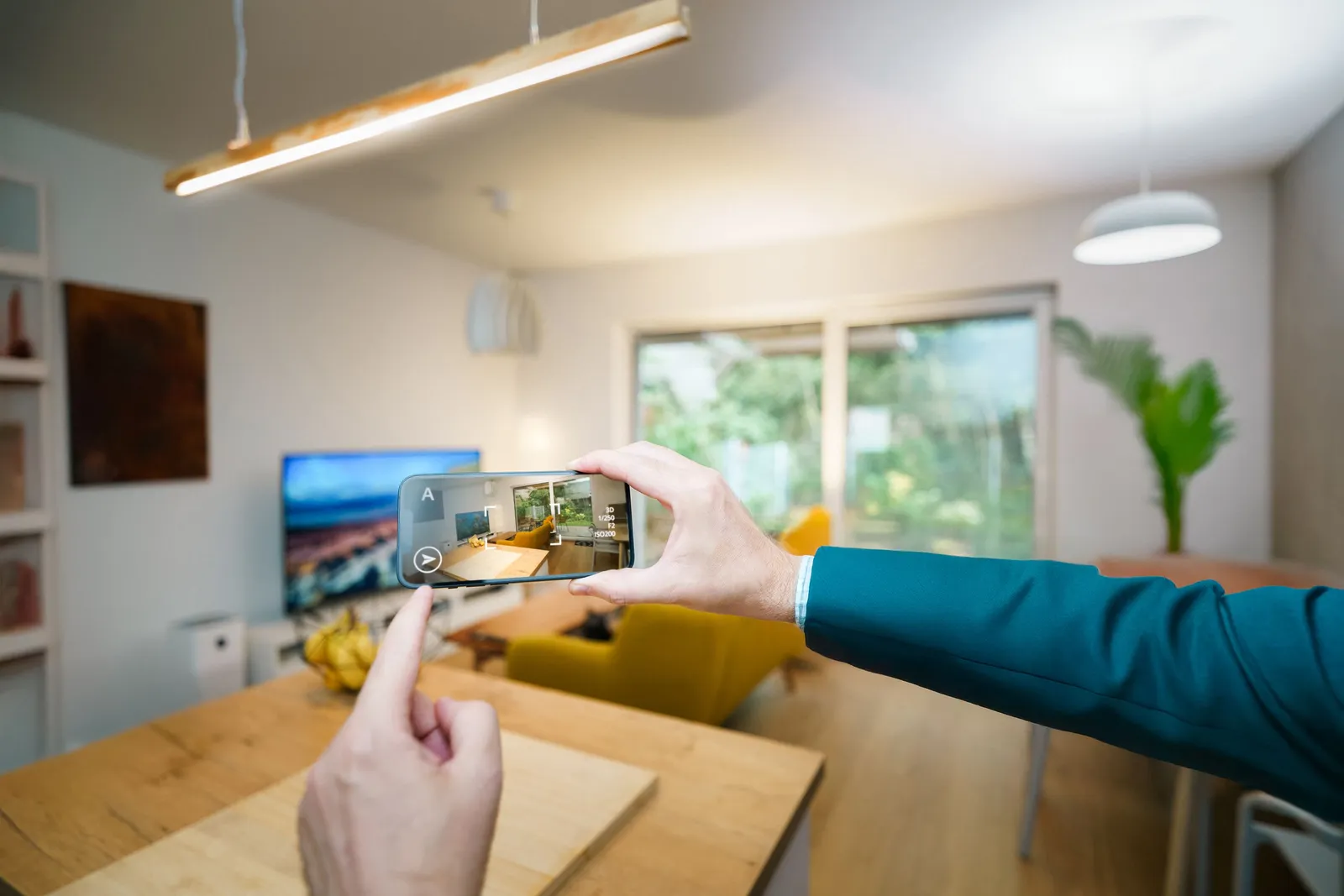 Filming a modern living room with a smartphone to create a property video tour